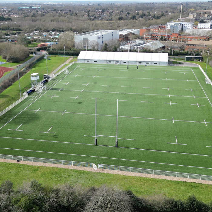 Brunel Sports Park rugby pitch from the air, with the outdoor athletics track alongside it