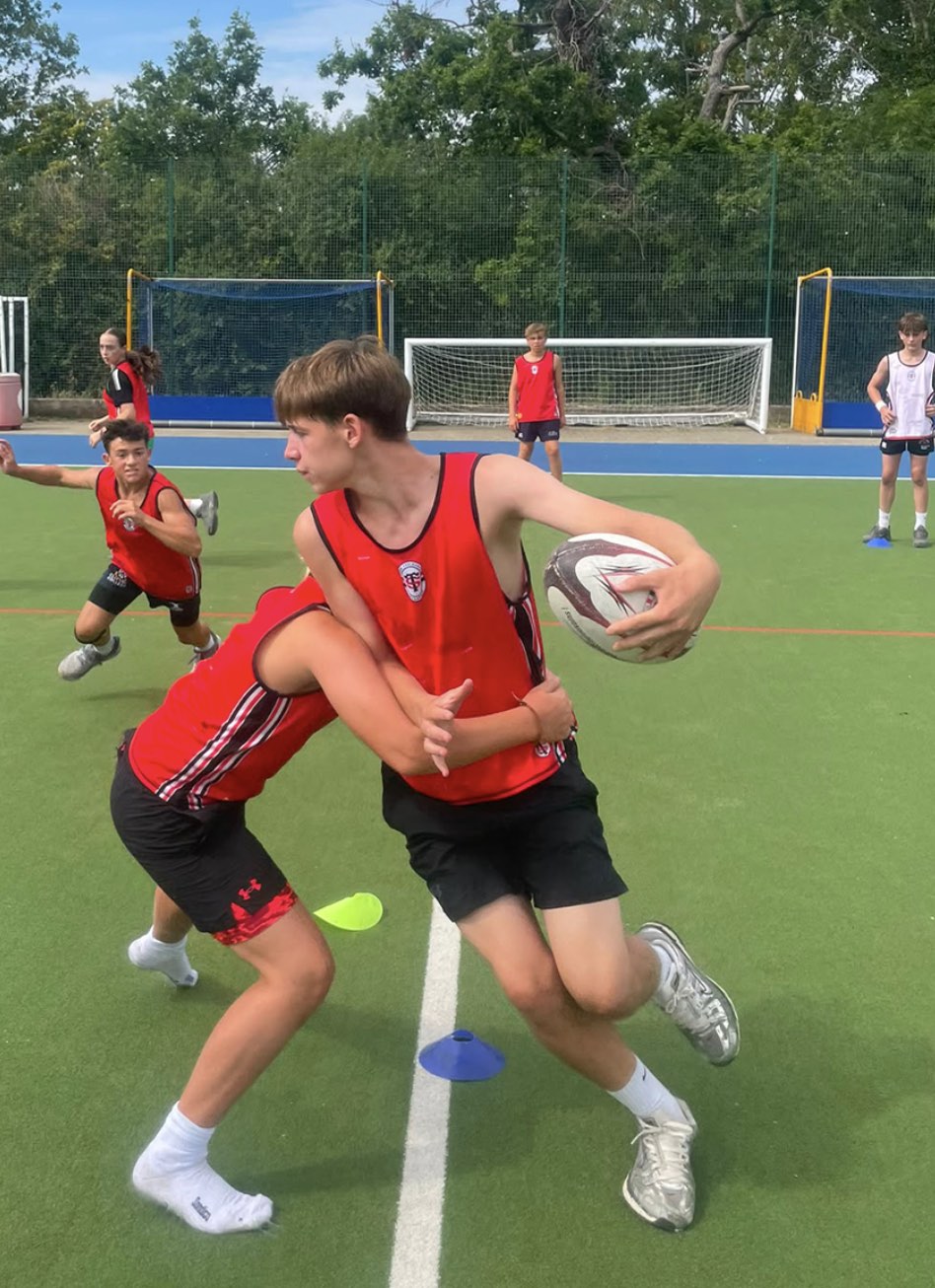 An older camp player carrying into contact